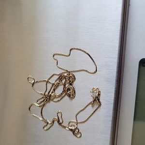 10k Gold necklace with diamond pendant.